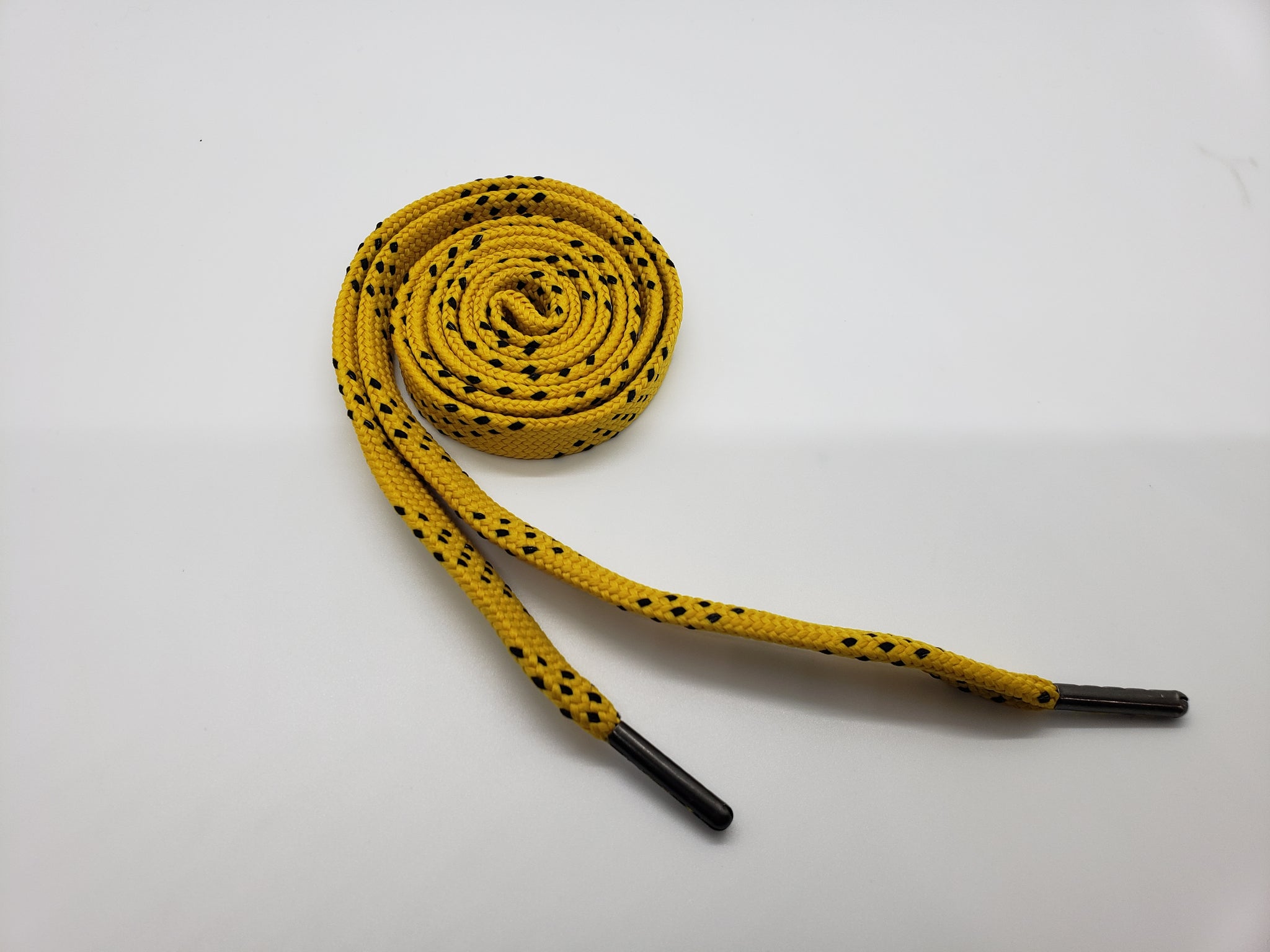 A roll of our yellow and black premium sport laces.