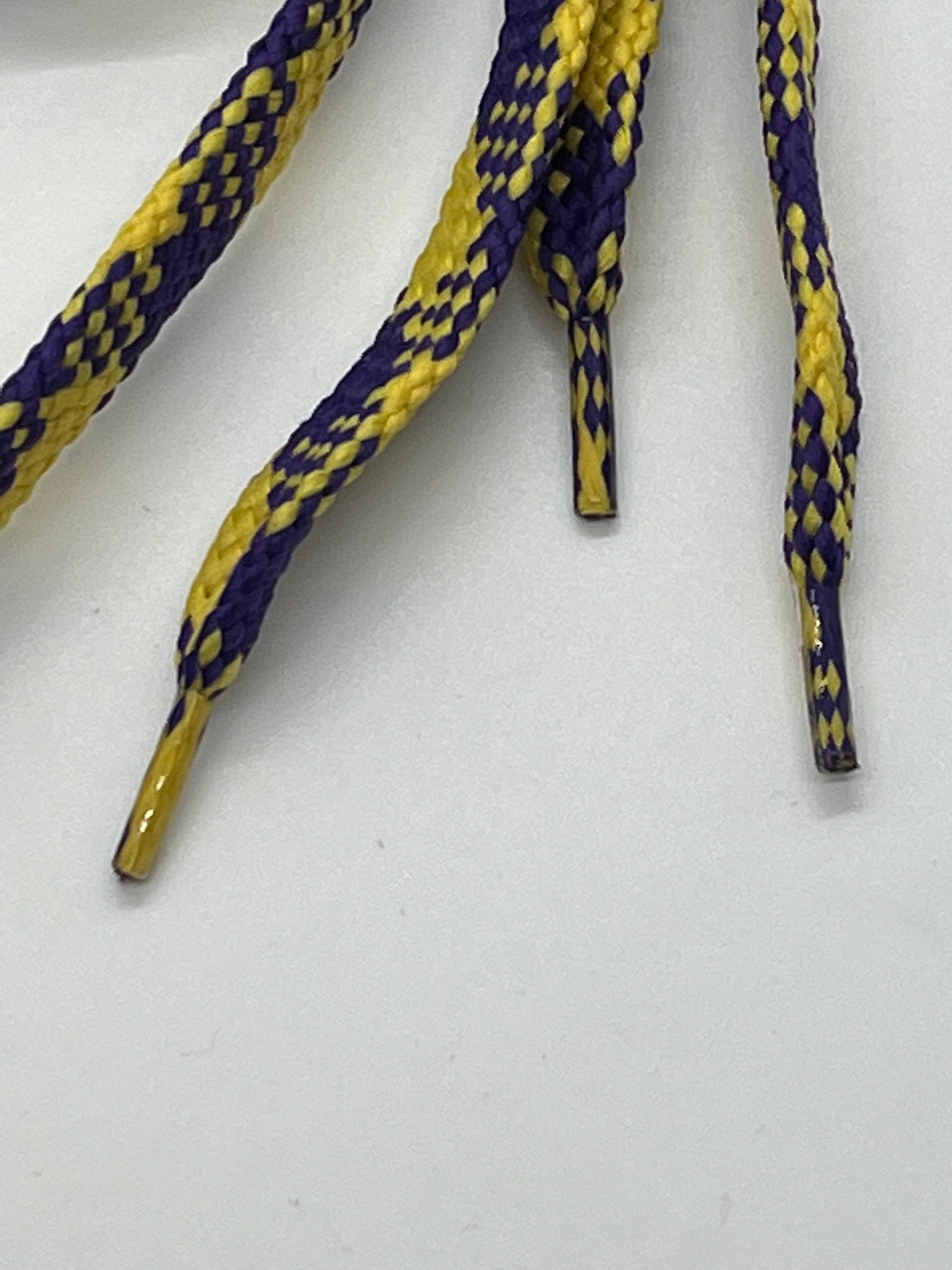 Purple and 2025 yellow shoelaces