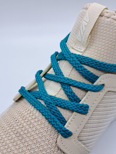 Our teal narrow laces in a looking good against a cream colored shoe.